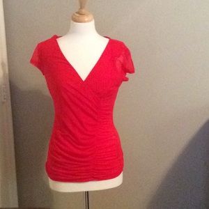 Red figure flattering ruched blouse